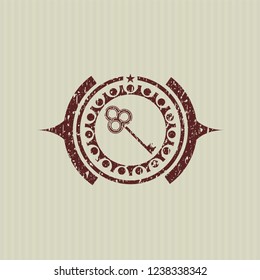 Red key icon inside distressed grunge seal