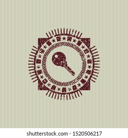 Red key icon inside distressed with rubber seal texture