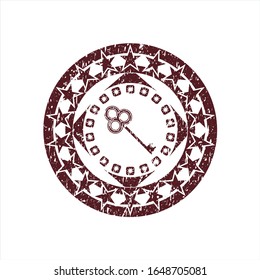 Red key icon inside grunge style stamp