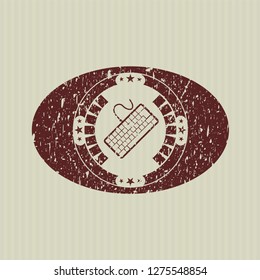 Red keyboard icon inside distress rubber grunge seal