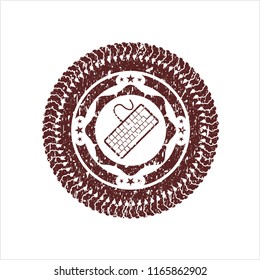 Red keyboard icon inside distressed rubber stamp