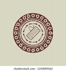 Red keyboard icon inside grunge style stamp