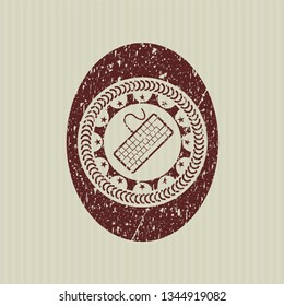 Red keyboard icon inside rubber grunge seal