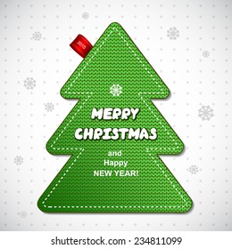 Red knitted Christmas pine tree label can be used as a greeting card