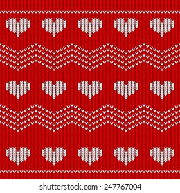 Red knitted seamless pattern with hearts. Vector illustration