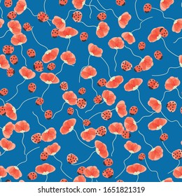 red and ladybugs on blue background seamless vector pattern