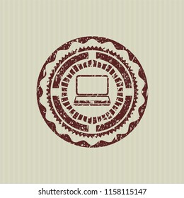 Red laptop icon inside distressed grunge style stamp
