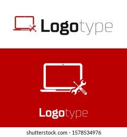 Red Laptop with screwdriver and wrench icon isolated on white background. Adjusting, service, setting, maintenance, repair, fixing. Logo design template element. Vector Illustration