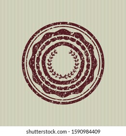 Red leaf crown icon inside rubber stamp