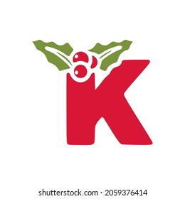 Red letter k with mistletoe, Christmas lettering vector clip art isolated on white background