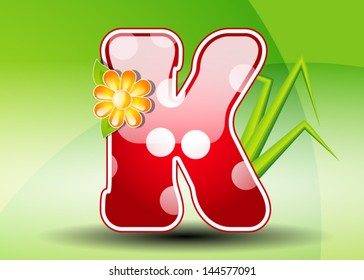 Red letter K with spots
