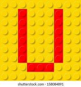 Red letter U in yellow plastic construction kit. Typeface  sample.
