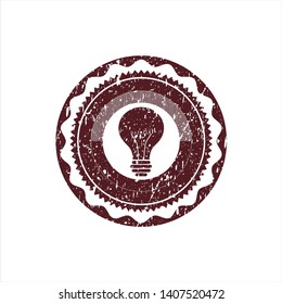 Red light bulb icon inside distress grunge stamp