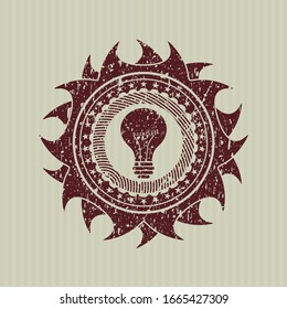 Icono de la bombilla roja dentro del retén de caucho del distrés con textura gruesa