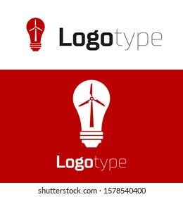 Red Light bulb with wind turbine as idea of eco friendly source of energy icon isolated on white background. Alternative energy concept. Logo design template element. Vector Illustration