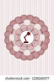 Red linear rosette with desk lamp icon inside