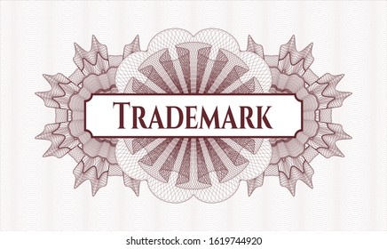 Red linear rosette with text Trademark inside