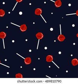 Red lollipop on a blue background