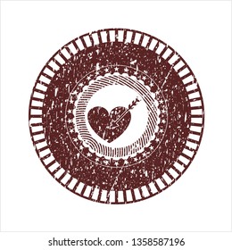 Red love icon inside distress rubber seal with grunge texture