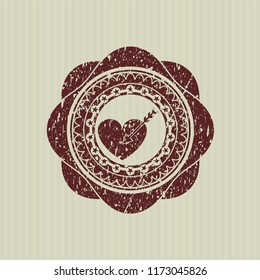 Red love icon inside rubber grunge stamp
