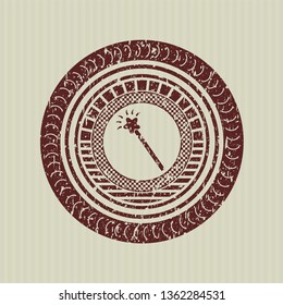 Red magic stick icon inside distress rubber seal with grunge texture