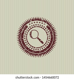 Red magnifying glass icon inside rubber grunge texture seal