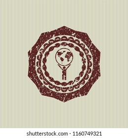 Red man lifting world icon inside grunge stamp