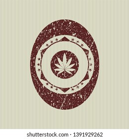 Red marijuana leaf icon inside distressed rubber grunge texture stamp