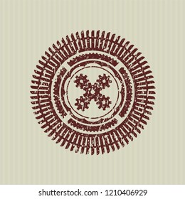 Red mechanism icon inside distressed rubber texture