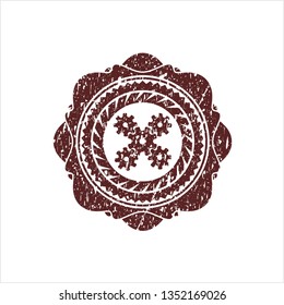 Red mechanism icon inside rubber stamp with grunge texture