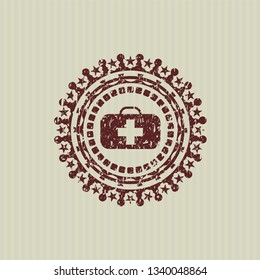 Red medical briefcase icon inside distress grunge seal