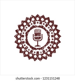 Red microphone icon inside distress rubber stamp