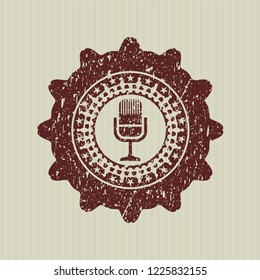 Red microphone icon inside distressed rubber texture