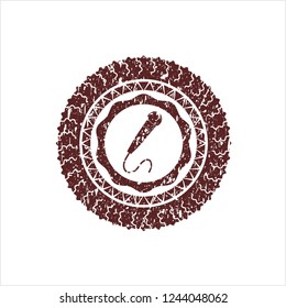 Red microphone icon inside distressed rubber grunge texture seal