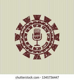 Red microphone icon inside distressed with rubber seal texture