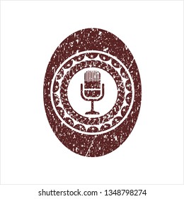 Red microphone icon inside rubber seal