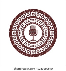 Red microphone icon with rubber seal texture