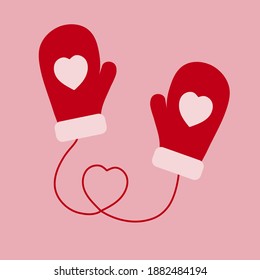 Red mittens with a pattern in the form of a heart.