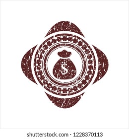 Red money bag icon inside distress rubber grunge stamp