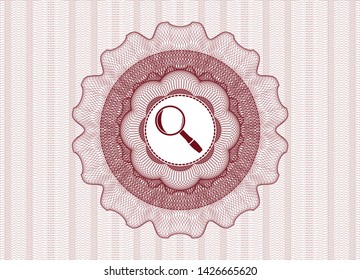 Red money style emblem or rosette with magnifying glass icon inside