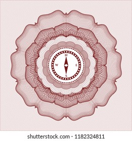 Red money style rosette with compass icon inside
