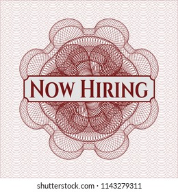 Red money style rosette with text Now Hiring inside