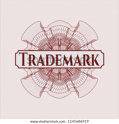 Red money style rosette with text Trademark inside