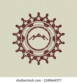 Red mountain icon inside rubber seal