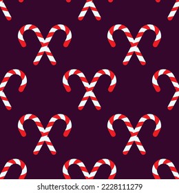Red New Year lollipops on dark violet background for textile, fabric, placards and other surfaces 