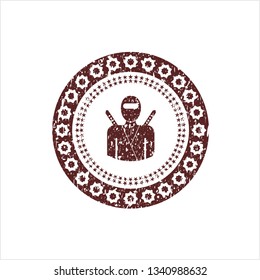 Red ninja icon inside distressed grunge stamp