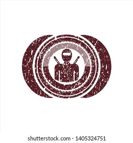 Red ninja icon inside grunge style stamp