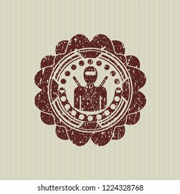 Red ninja icon inside rubber stamp