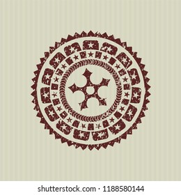 Red ninja star icon inside rubber stamp