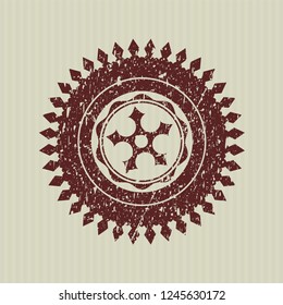 Red ninja star icon inside distress rubber seal